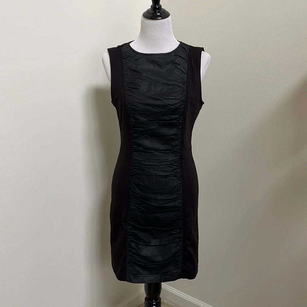 Black knit dress with faux leather insert.